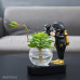 Статуэтка космонавт с цветочной вазой золотистого цвета